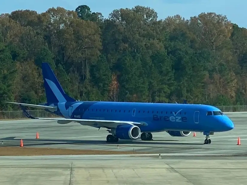 Breeze Airways plane on the runway.