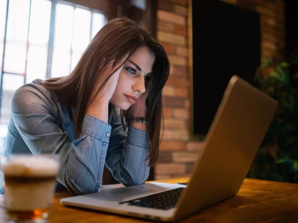 person looking frustrated at computer